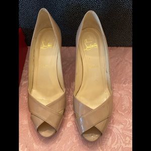 Christian Louboutin nude patent leather pumps.
